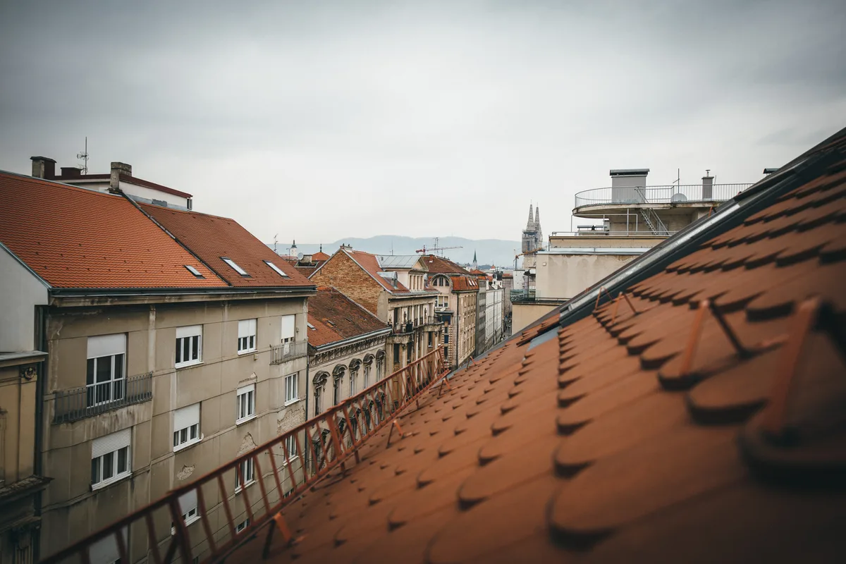 View over central Zagreb rooftops towards the twin spires of Zagreb Cathedral from the Woody 1 apartment