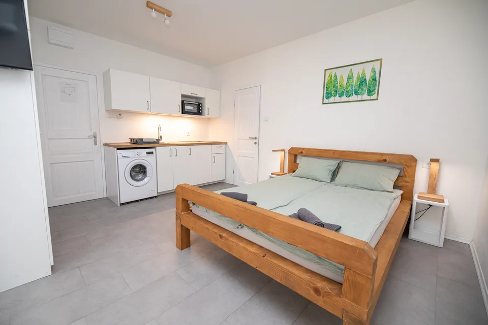 Woody 2 studio apartment in Zagreb with a pine double bed, kitchenette and washing machine