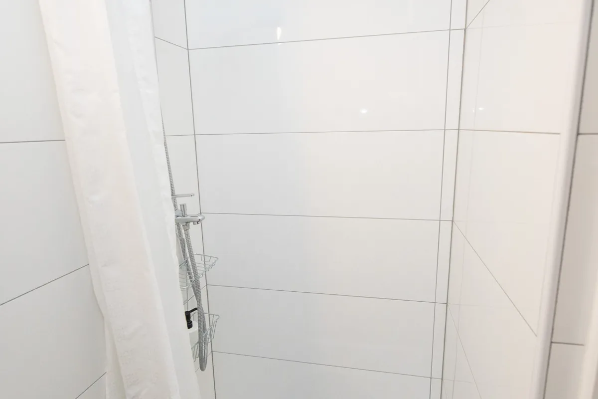 Corner shower in the private bathroom of Woody 2 studio apartment, Zagreb